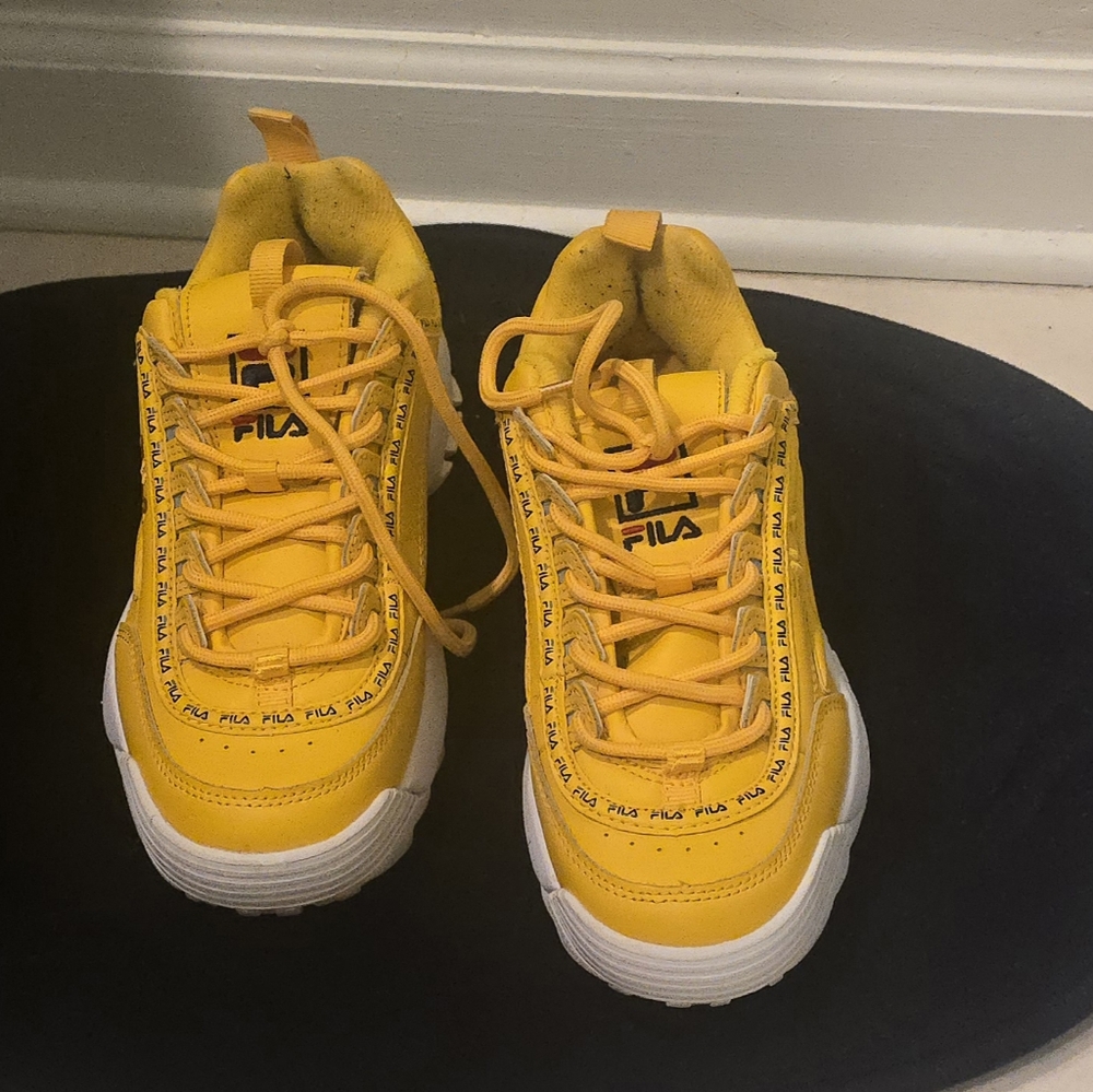 Yellow Fila Disruptors